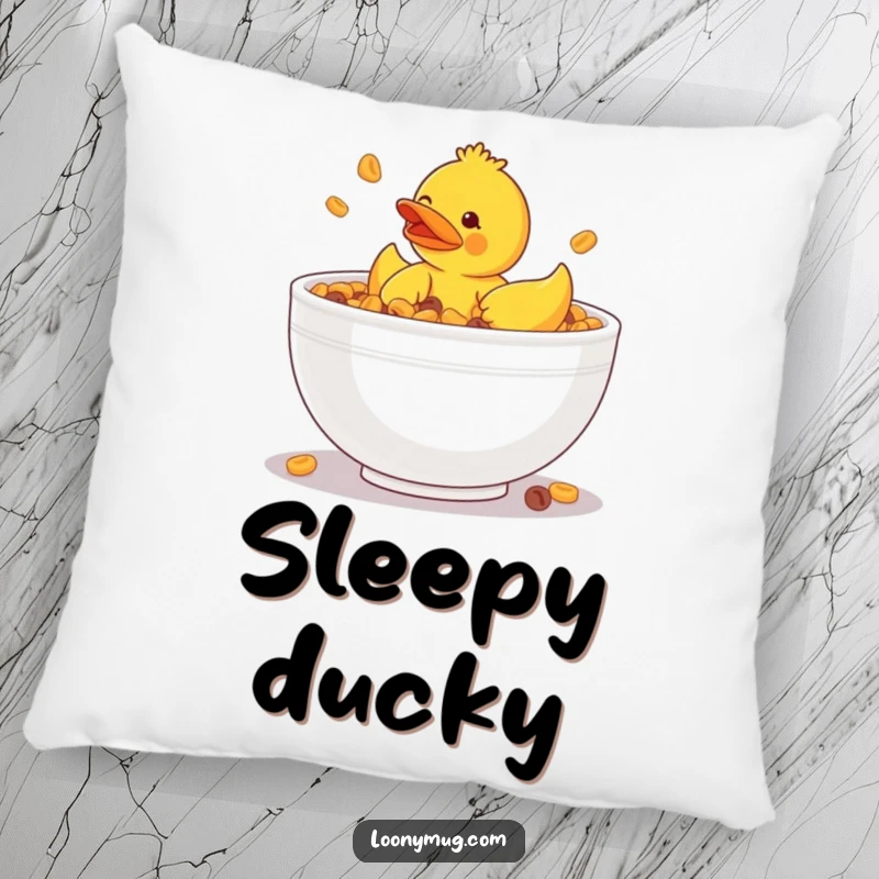 Funny pillow showcasing a rubber ducky hilariously stuck in a giant bowl of cereal, bringing soft, humorous decor.
