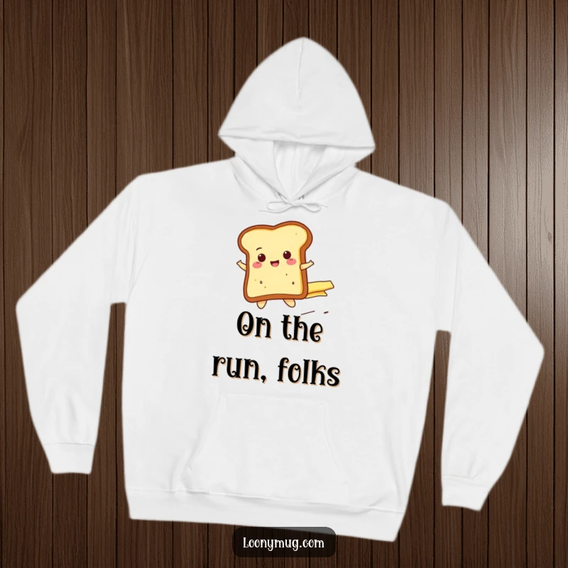 Funny cheerful toast slice riding a runaway butter pat, on a soft and warm hoodie. A humorous and comfortable apparel choice.