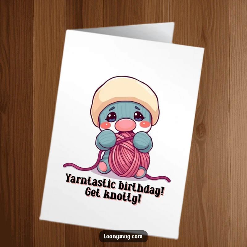 Funny Free Printable Birthday Card: Mischievous sock puppet hilariously tries to eat a ball of yarn, conveying playful birthday wishes.