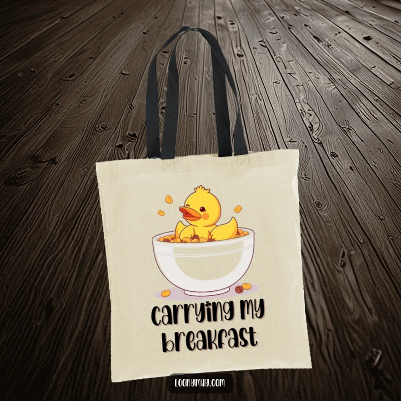 Funny tote bag illustrating a rubber ducky stuck in a giant bowl of cereal, perfect for carrying essentials with humor.